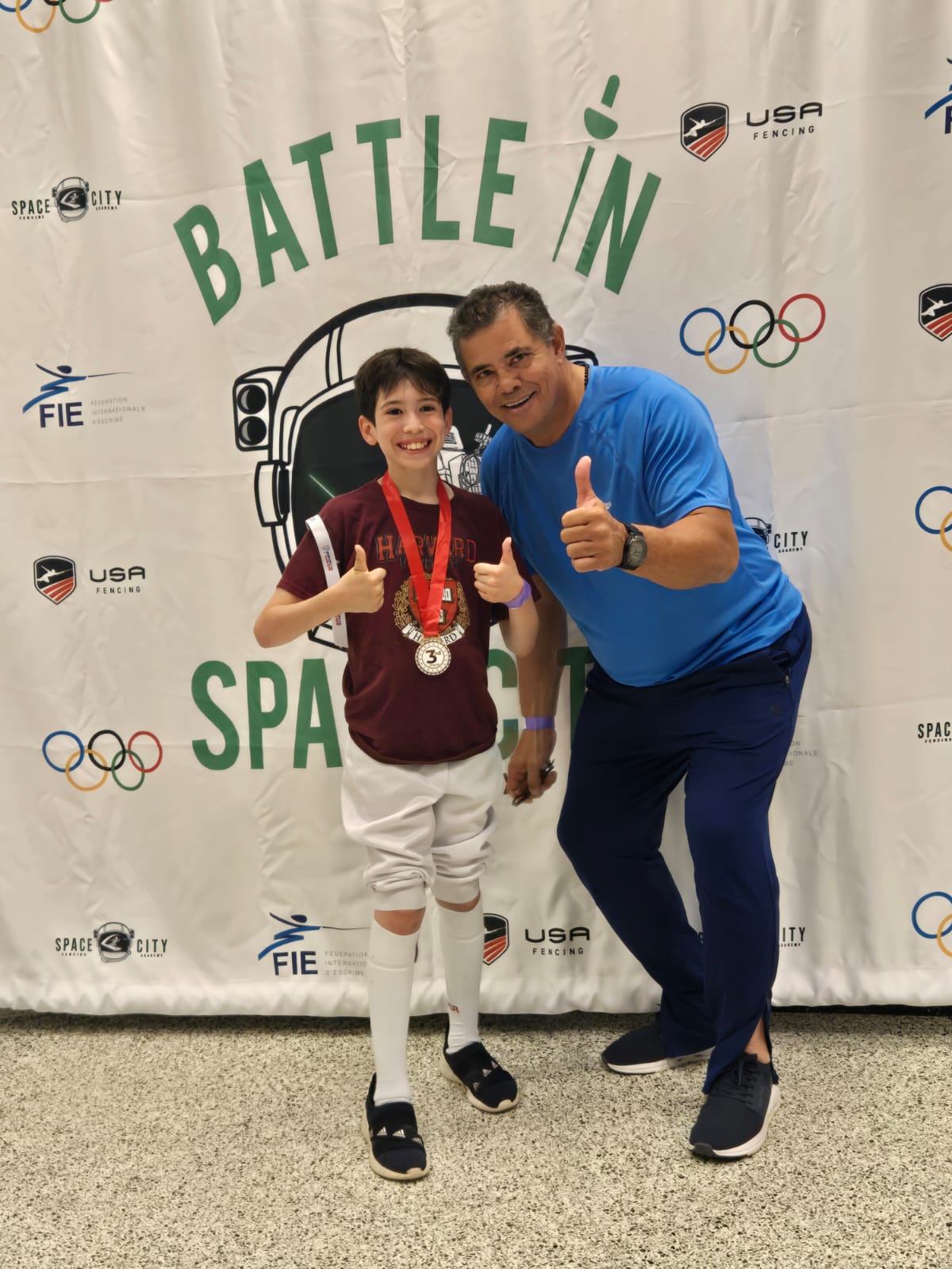 Young fencer with 3rd place medal at Battle in Space City