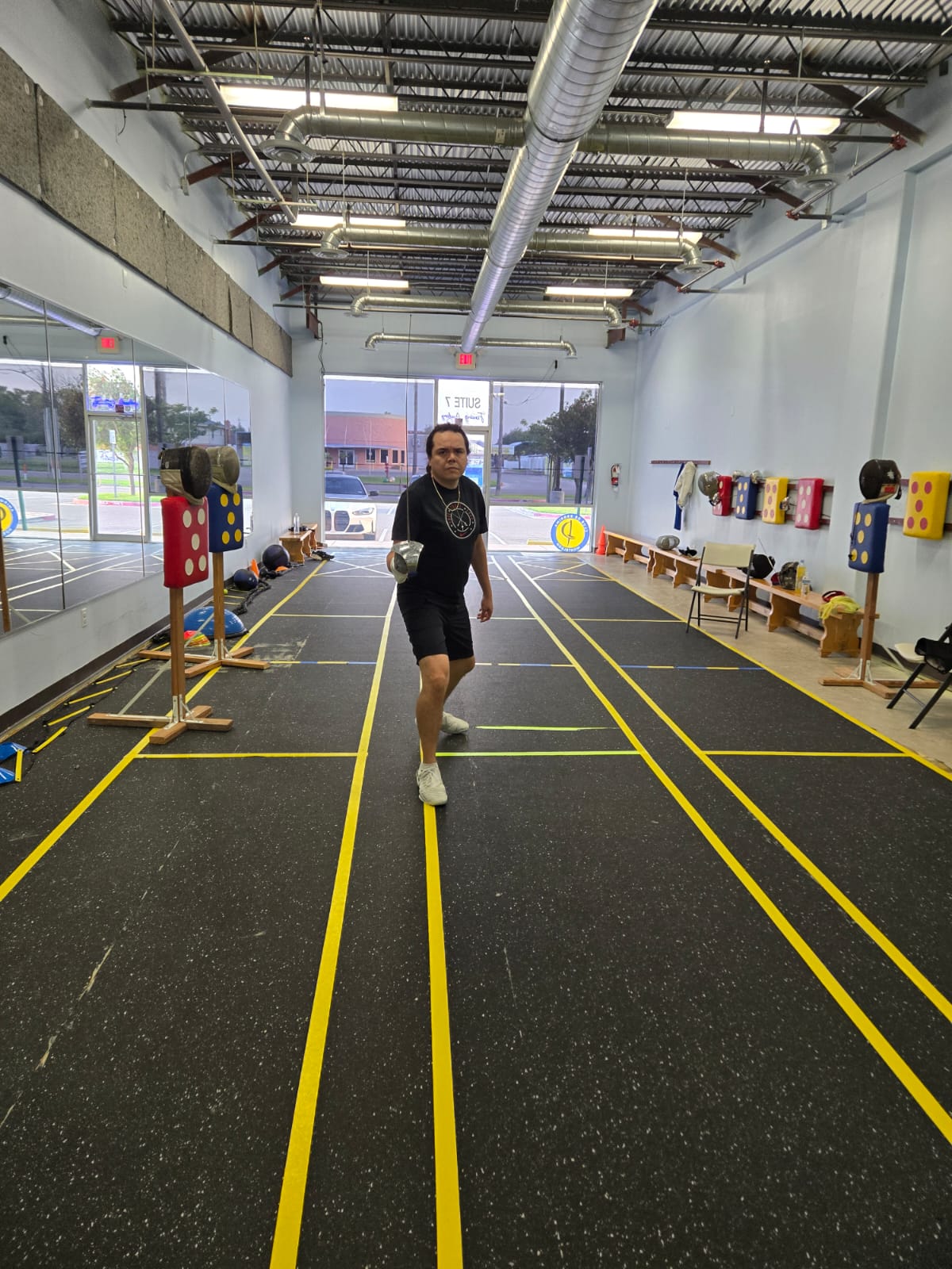 Coach on the fencing strip