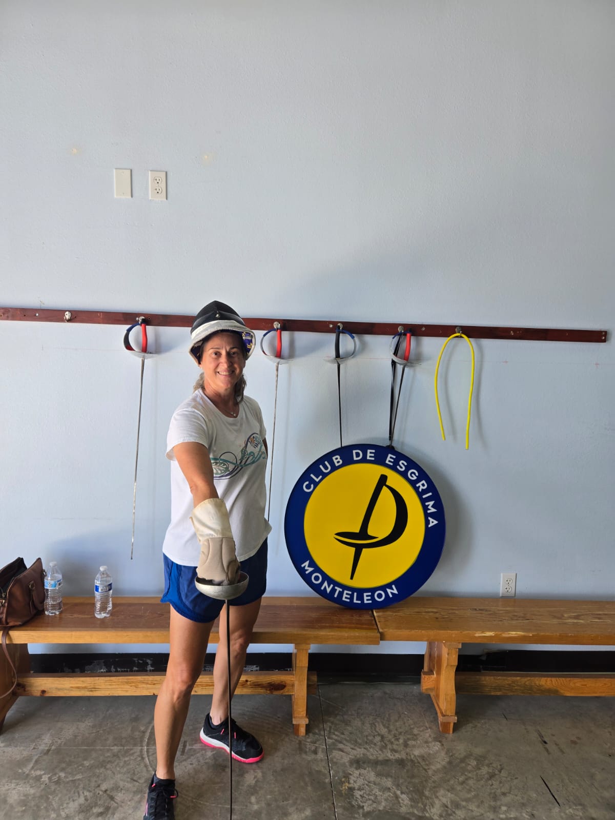 Adult fencer training with the club