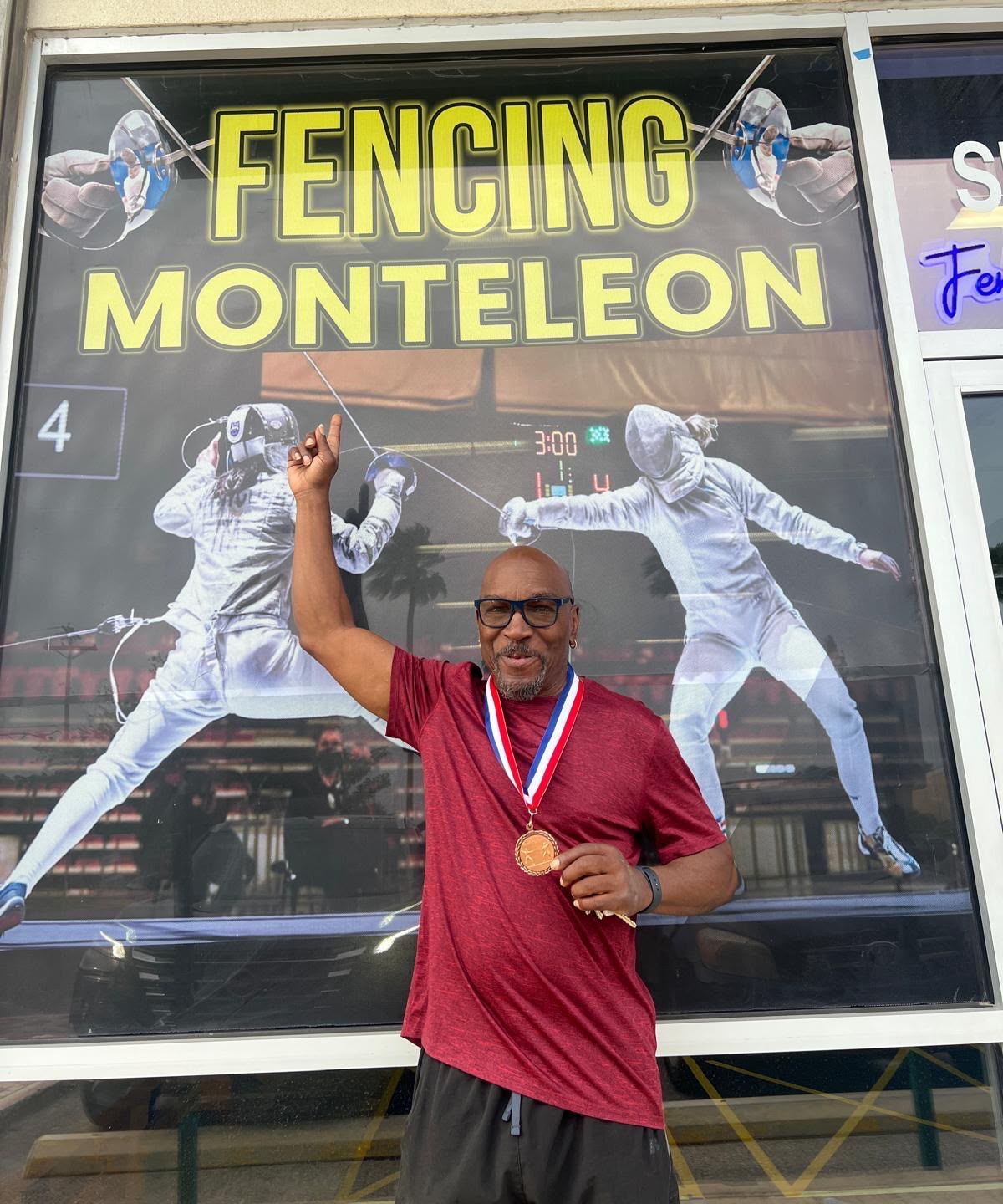 Senior fencer celebrating 3rd place at the tournament
